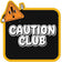 A die-cut sticker featuring a black rounded square with the words 'CAUTION CLUB' in bold white letters outlined in black, surrounded by a yellow border. A cartoon orange warning triangle peeking from the top left adds a surprised face and peace sign.